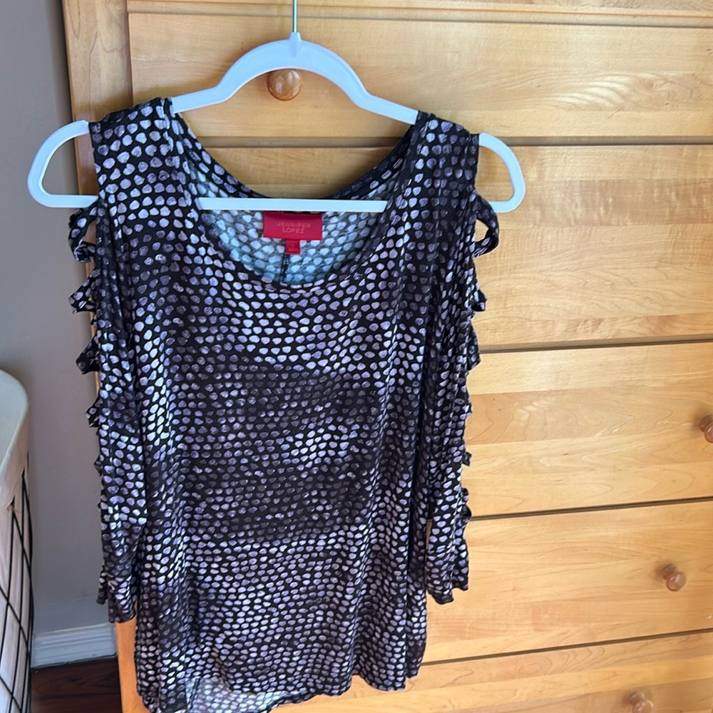 Jennifer Lopez knit open criss cross ladder arm cut out top